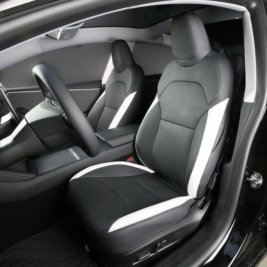 Sea Dragon Dreams black and white leather seat covers installed in a Tesla Model 3 or Model Y interior.