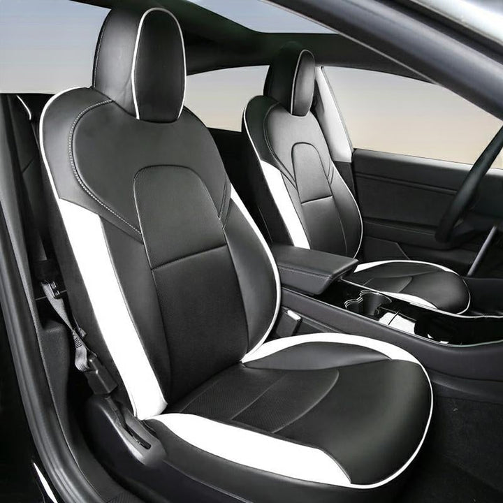 Sea Dragon Dreams black and white leather seat covers installed in a Tesla Model 3 or Model Y interior
