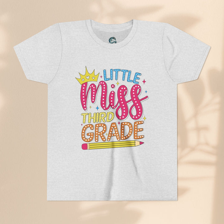 Sea Dragon Dreams youth tee with Little Miss Third Grade graphic featuring a crown and pencil on soft white cotton.