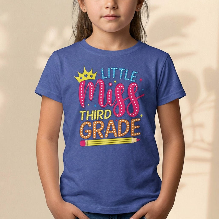 Sea Dragon Dreams youth t-shirt in blue featuring a Little Miss Third Grade graphic with a crown and pencil design.