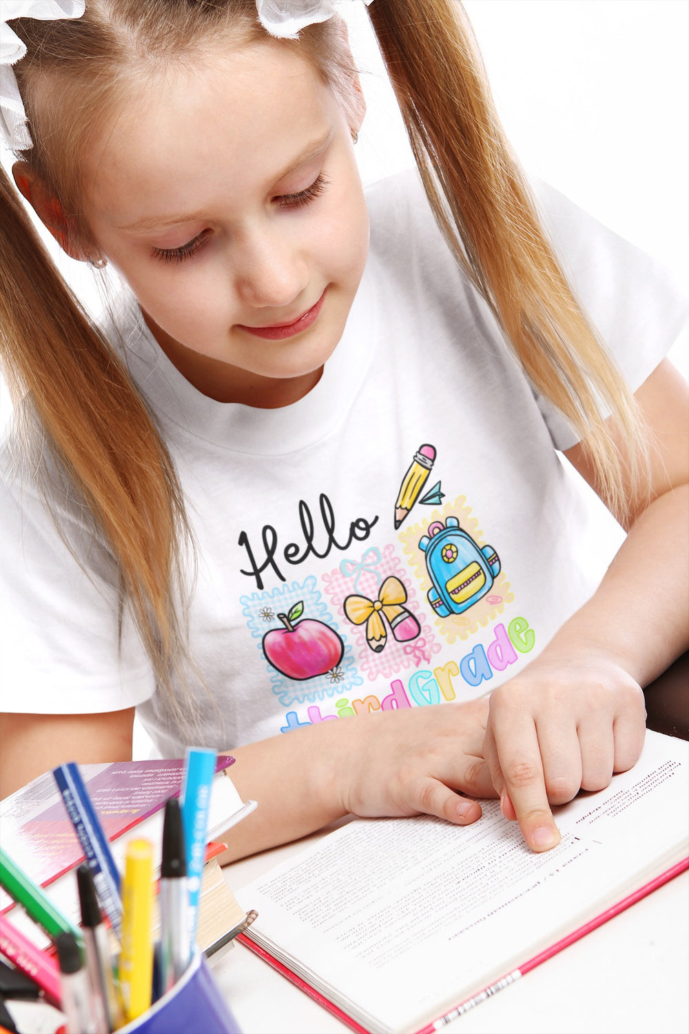 Sea Dragon Dreams white cotton youth t-shirt with colorful Hello Third Grade school graphic worn by a young girl