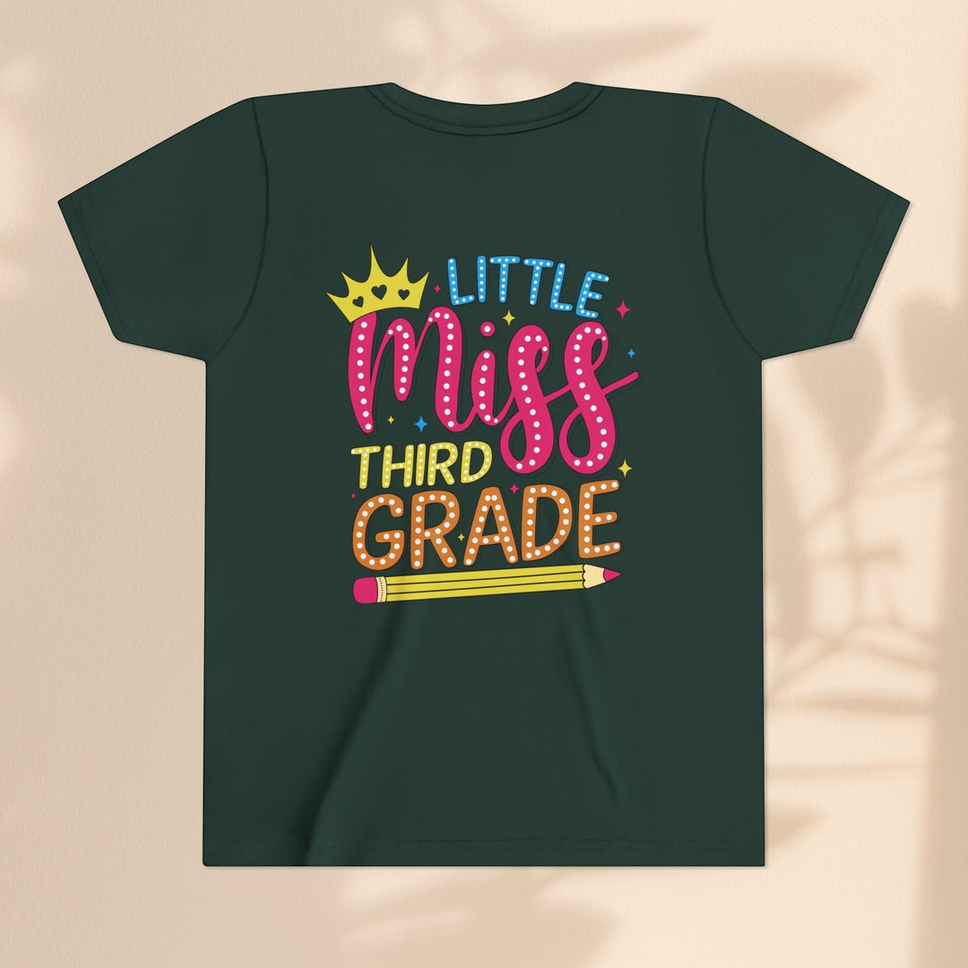 Sea Dragon Dreams dark green youth t-shirt with Little Miss Third Grade graphic featuring a crown and pencil design.