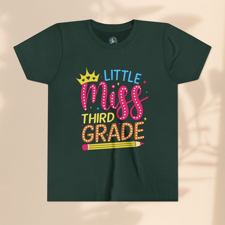 Sea Dragon Dreams youth t-shirt in dark green cotton with Little Miss Third Grade graphic and pencil illustration.