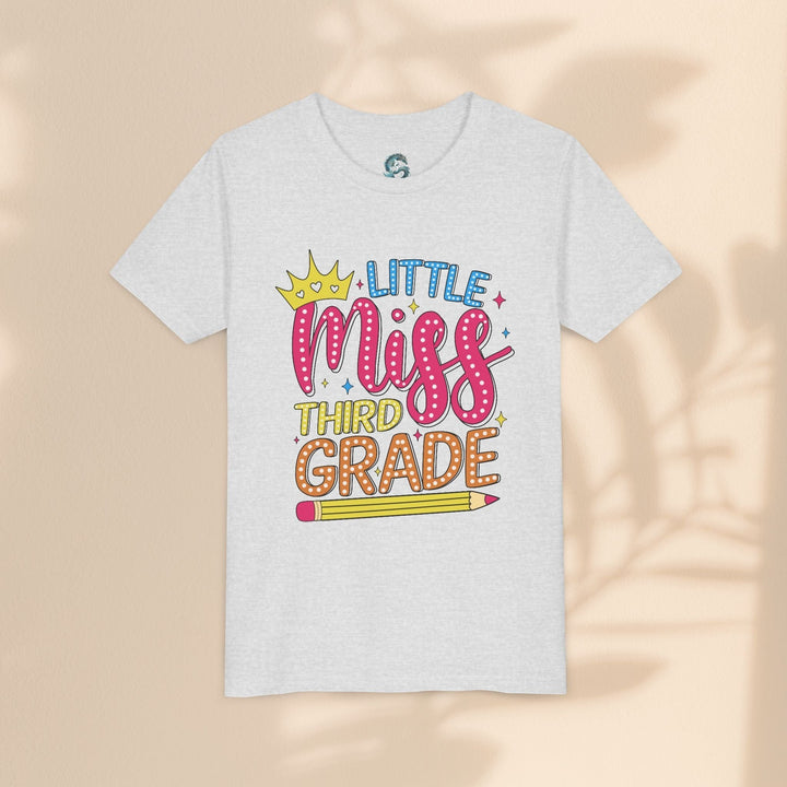 Sea Dragon Dreams youth tee in heather grey cotton with a Little Miss Third Grade graphic featuring a crown and pencil
