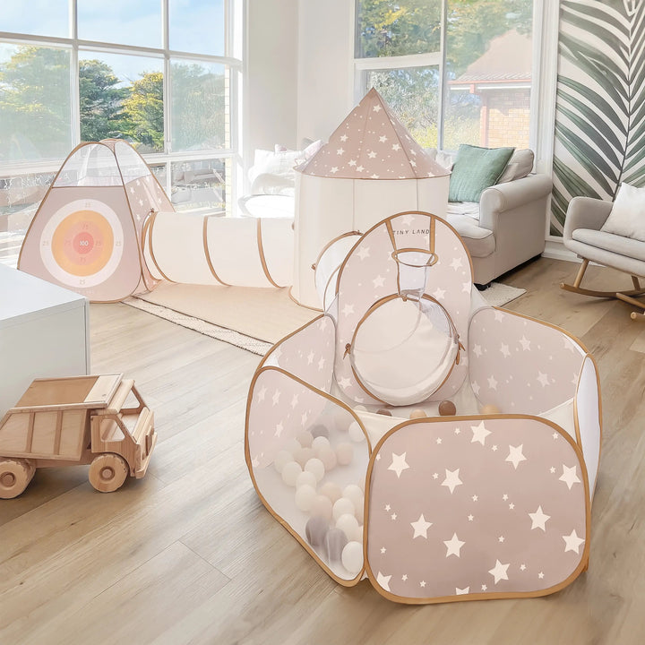 Sea Dragon Dreams Tiny Land Discovery 5-in-1 beige star-patterned polyester play tunnel and tent set in a bright room.