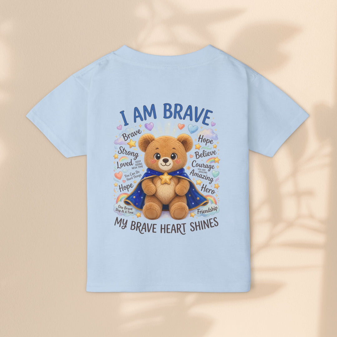 Sea Dragon Dreams toddler t-shirt in light blue cotton featuring a teddy bear graphic with I Am Brave text
