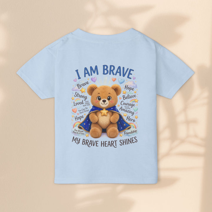 Sea Dragon Dreams toddler t-shirt in light blue cotton featuring a teddy bear graphic with I Am Brave text