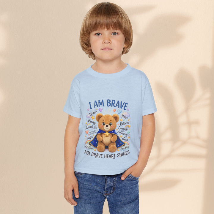 Sea Dragon Dreams toddler t-shirt in light blue cotton featuring a cute teddy bear graphic and I Am Brave text.