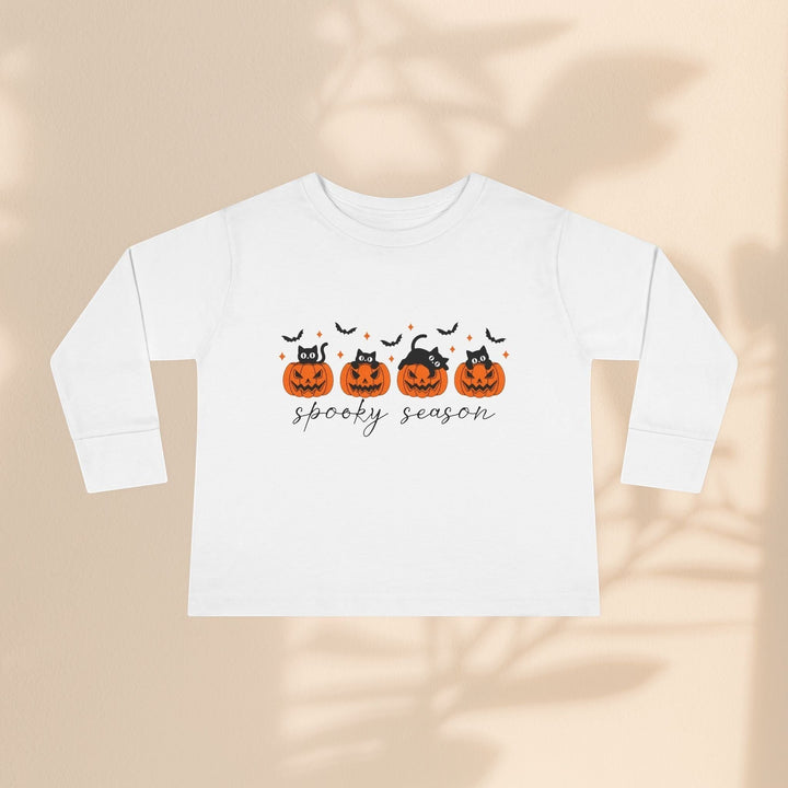 Sea Dragon Dreams white toddler long sleeve tee with spooky season pumpkin and black cat Halloween graphic print