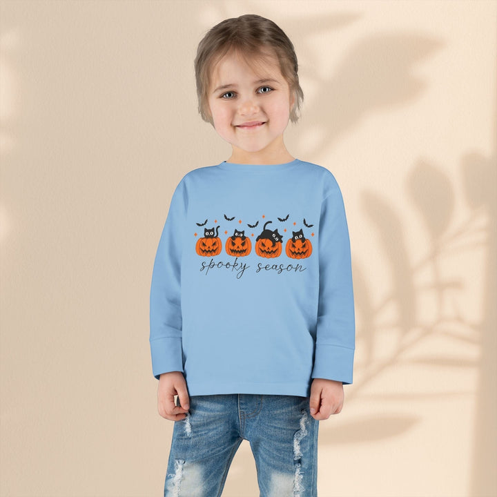 Sea Dragon Dreams toddler light blue long sleeve Halloween tee with pumpkin and black cat print worn by a young child