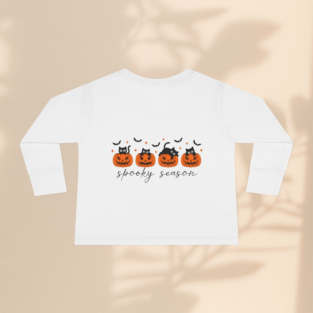 Sea Dragon Dreams white toddler long sleeve tee with black cats in orange pumpkins and spooky season text