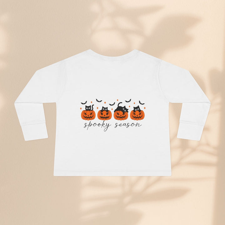 Sea Dragon Dreams white toddler long sleeve tee with black cats in orange pumpkins and spooky season text