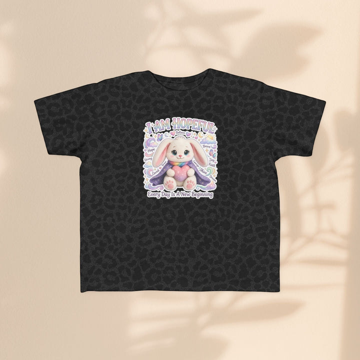 Sea Dragon Dreams toddler tee in black leopard print featuring a Hope Bunny graphic with the text I Am Hopeful.