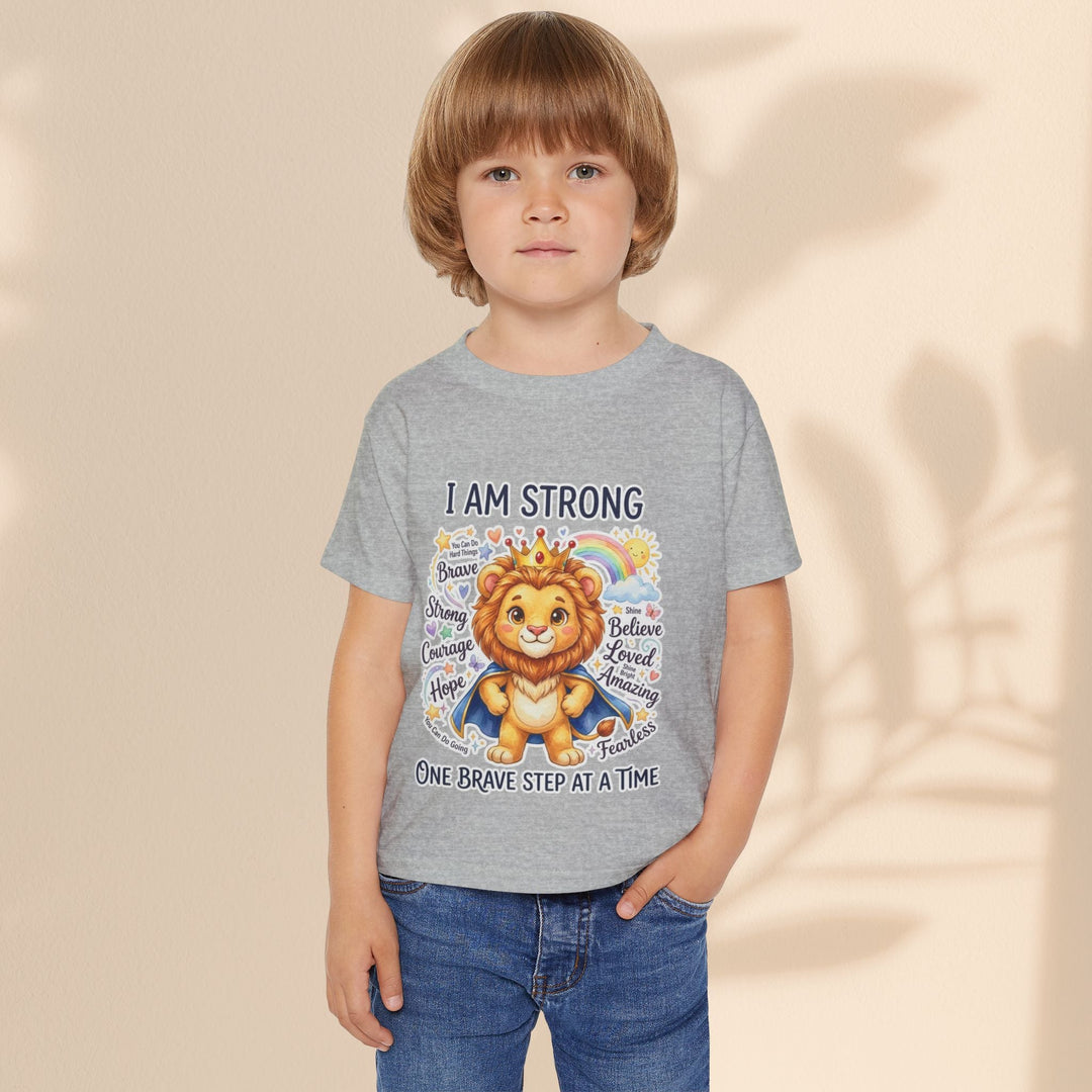 Sea Dragon Dreams toddler t-shirt in grey cotton featuring a courageous lion graphic with I Am Strong text