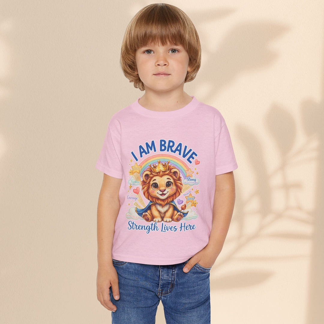 Sea Dragon Dreams toddler wearing a pink cotton t-shirt with a Leo Lion graphic and I Am Brave text.