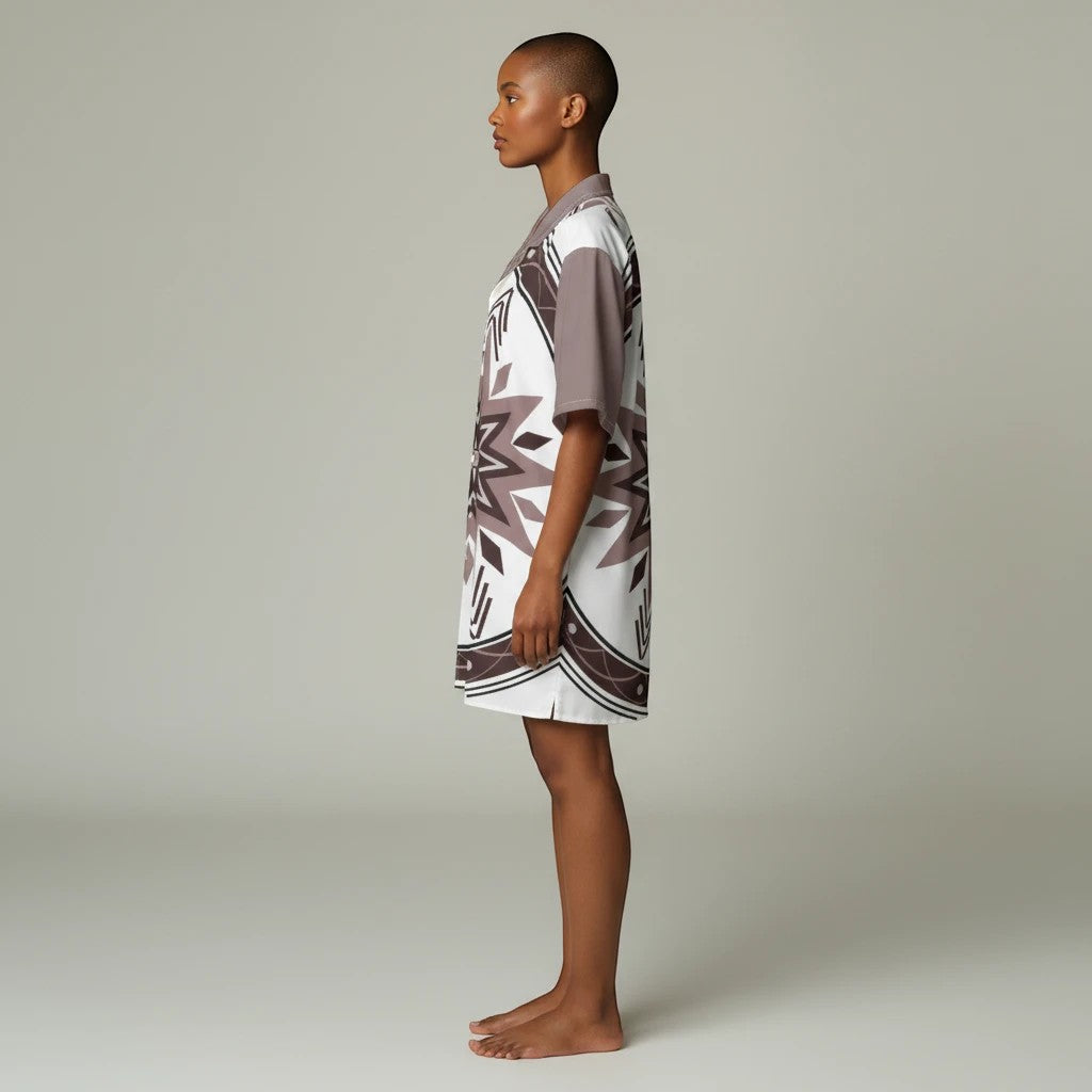 A model wearing a Sea Dragon Dreams unisex Hawaiian shirt with a brown and white tribal pattern and Cuban collar.