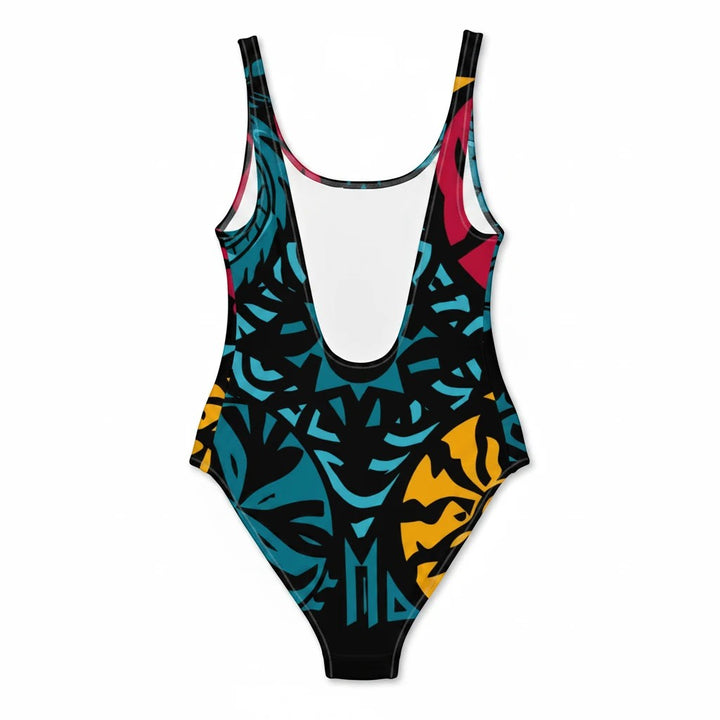 Sea Dragon Dreams one-piece swimsuit featuring a vibrant tribal-inspired pattern in blue, yellow, and red on black.