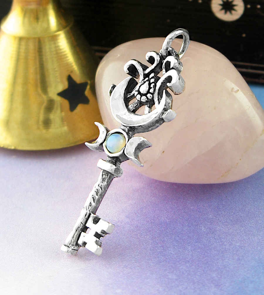 Sea Dragon Dreams handmade sterling silver key pendant featuring a Triple Moon symbol and natural opal cabochon.