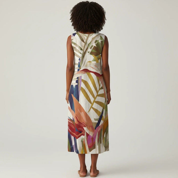 Sea Dragon Dreams sleeveless summer dress with a tropical leaf print in a loose A-line cotton slub fabric, back view
