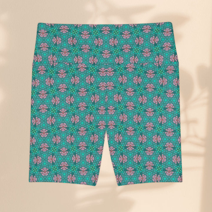 Sea Dragon Dreams women's workout shorts in teal and pink tropical geometric print, made of durable polyester.