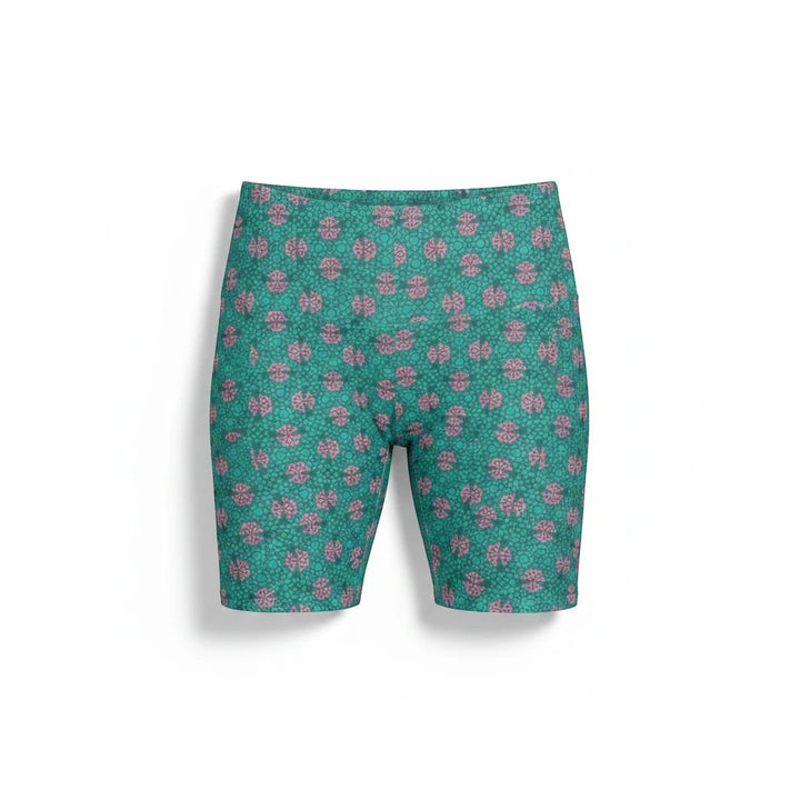 Sea Dragon Dreams women's workout shorts in teal with a pink tropical geometric pattern, made of durable polyester.