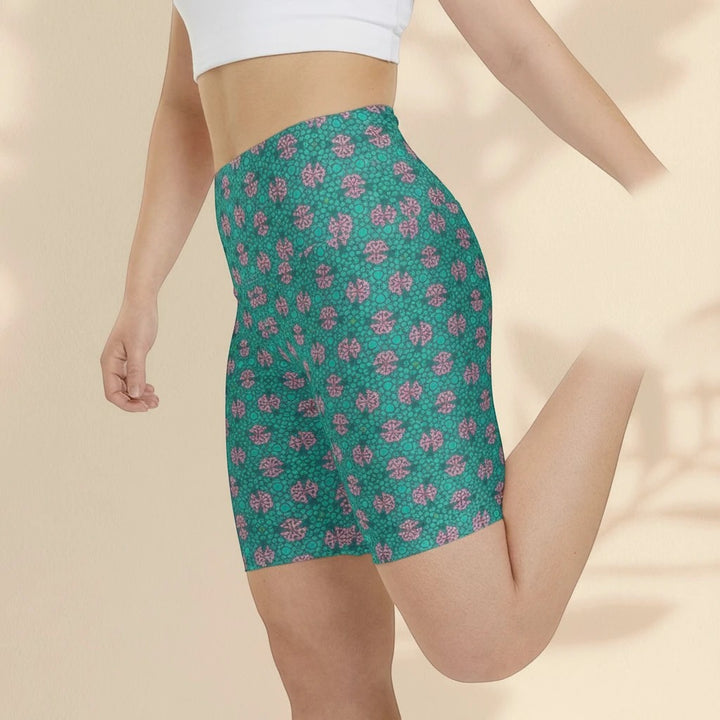 Sea Dragon Dreams women's workout shorts in teal and pink tropical print, made of quick-dry polyester for fitness.