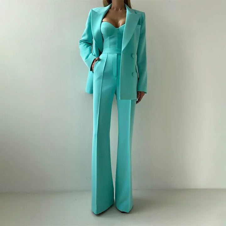 Sea Dragon Dreams three-piece turquoise pantsuit featuring a tailored blazer, corset bustier, and straight-leg trousers.