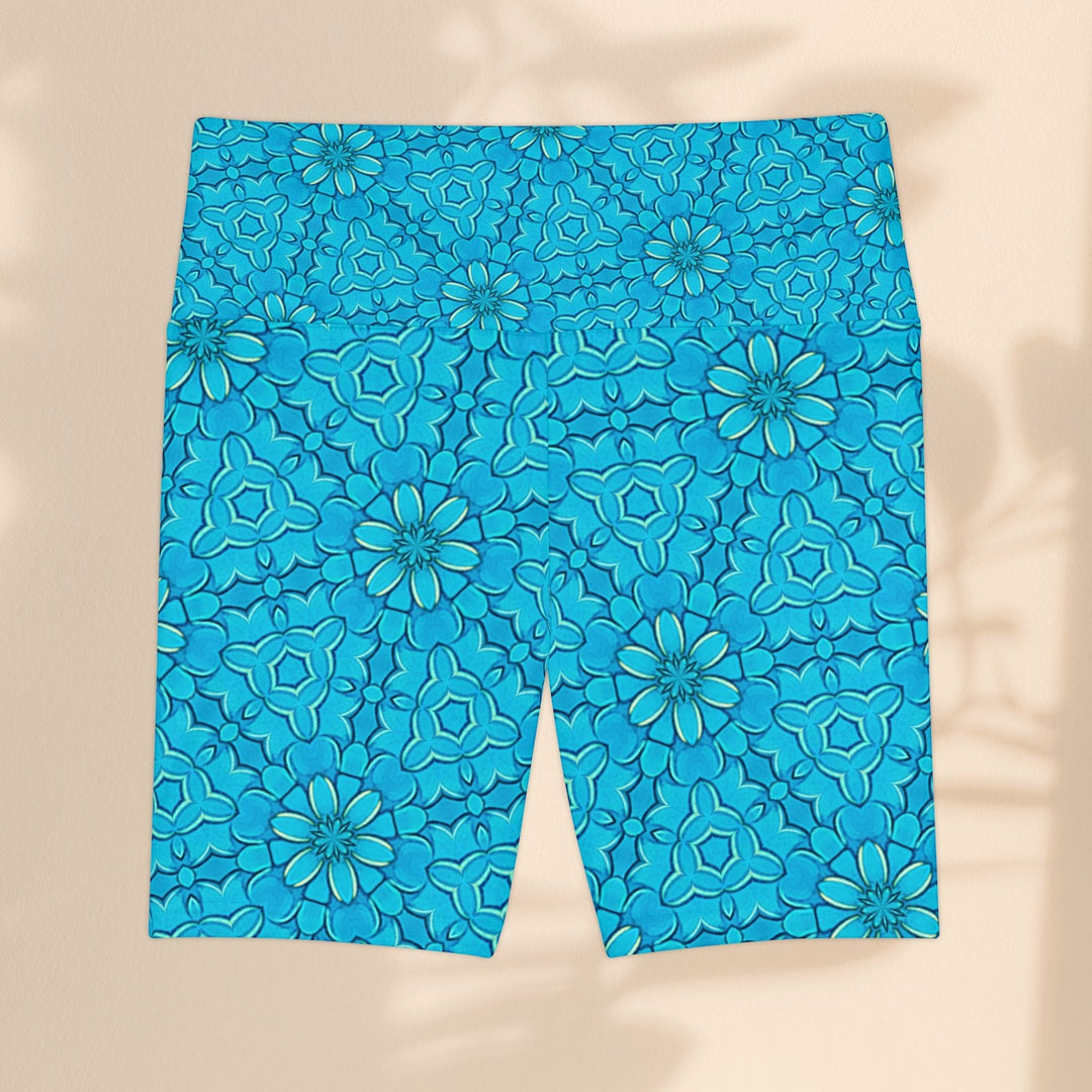 Sea Dragon Dreams turquoise workout shorts with a groovy floral pattern, made from lightweight, quick-dry polyester.