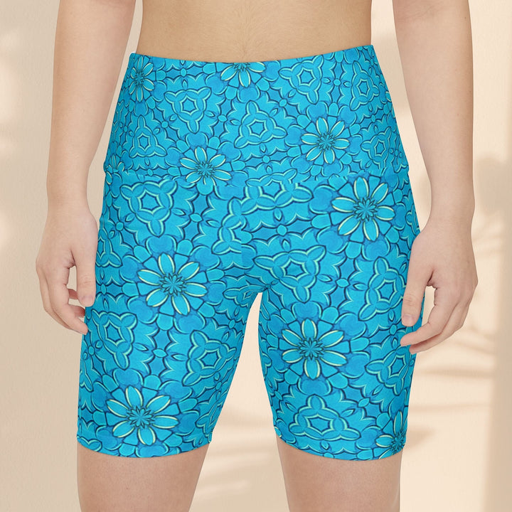 Sea Dragon Dreams turquoise workout shorts with a groovy floral pattern, made from lightweight polyester for active wear.