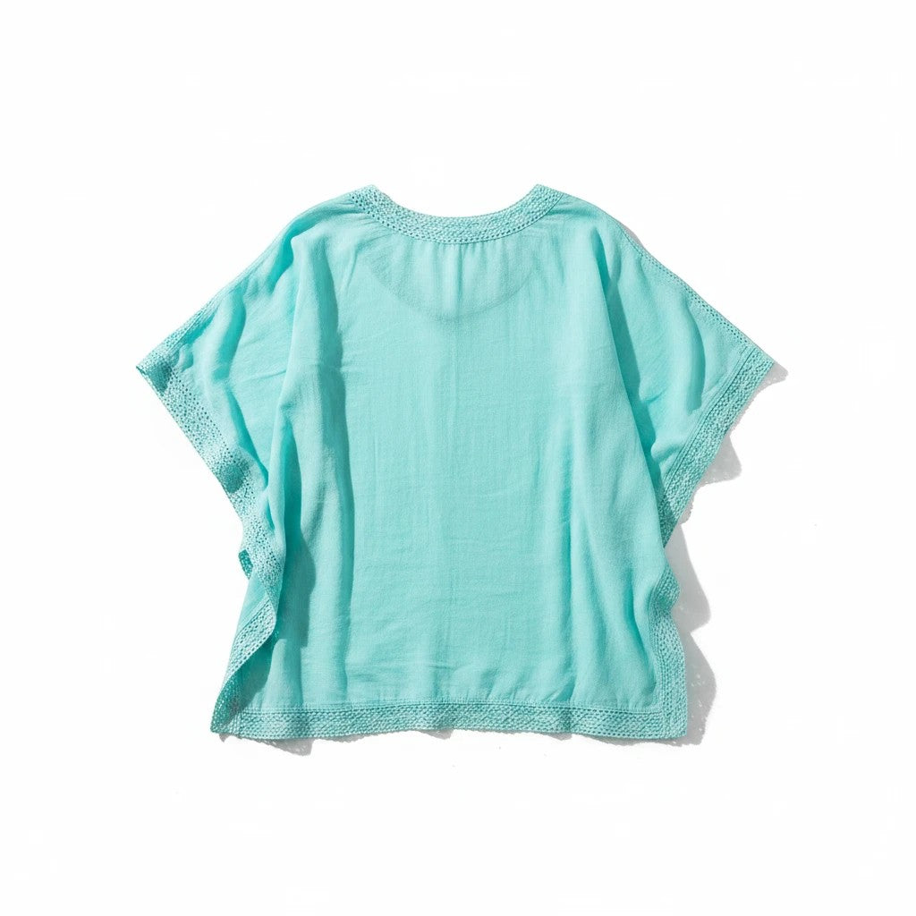 Sea Dragon Dreams turquoise lace beach cover-up with a breezy relaxed fit and delicate trim details