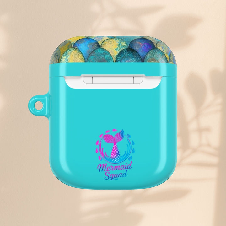 Sea Dragon Dreams turquoise AirPods case with a mermaid tail graphic and Mermaid Squad text on a neutral background.
