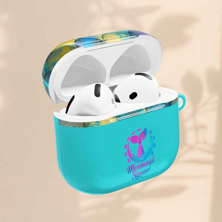 Sea Dragon Dreams turquoise AirPods case with Mermaid Squad tail design and patterned lid, open with earbuds inside.