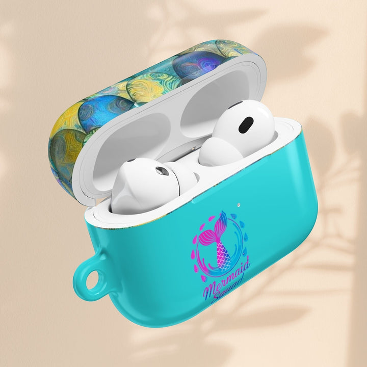 Sea Dragon Dreams turquoise AirPods case with Mermaid Squad tail design and patterned lid, open with earbuds inside.