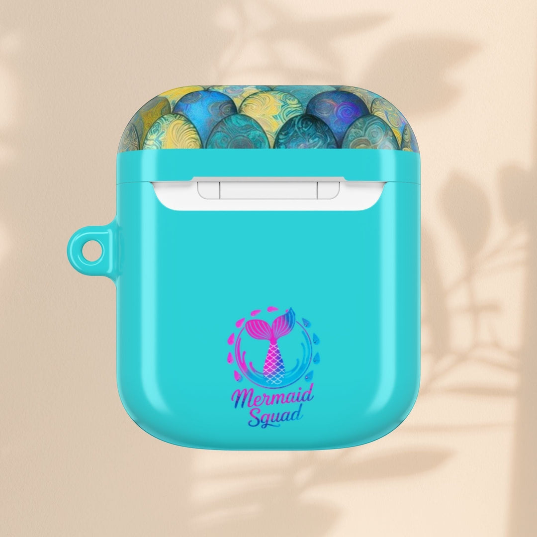 Sea Dragon Dreams turquoise AirPods case with a mermaid tail graphic and Mermaid Squad text on a neutral background.