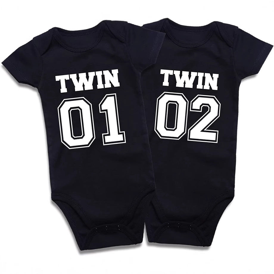 Sea Dragon Dreams matching black cotton baby bodysuits for twins with Twin 01 and Twin 02 white graphic print