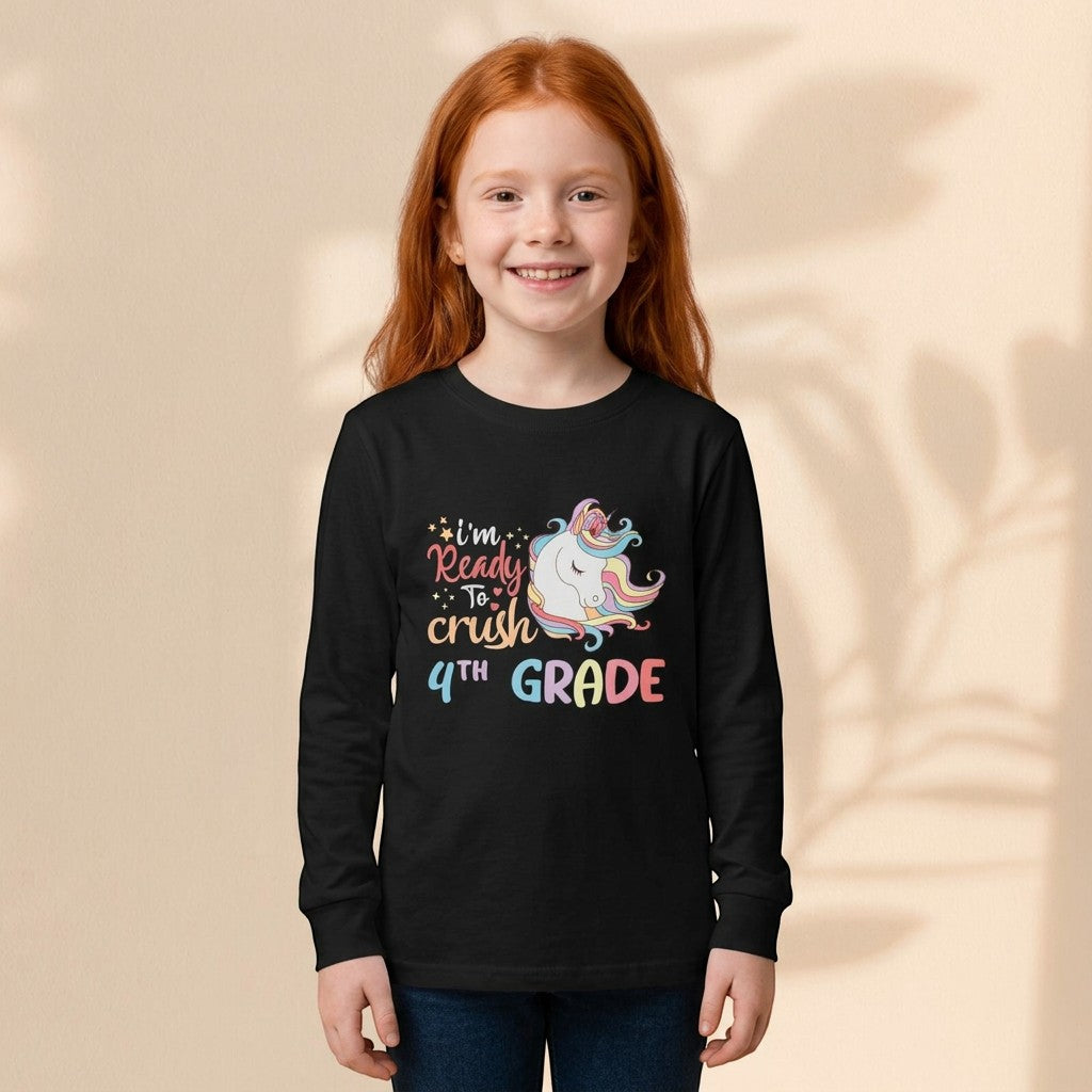 Girl wearing a Sea Dragon Dreams black long sleeve t-shirt with a colorful unicorn and 4th grade graphic design