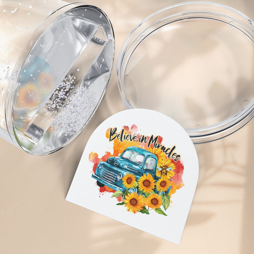Sea Dragon Dreams Believe in Miracles snow globe insert featuring a vintage blue truck and sunflowers on a beige surface