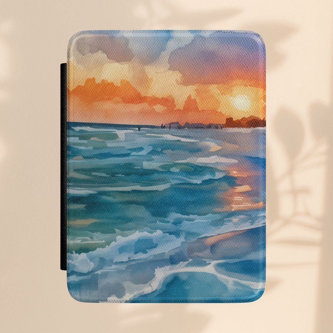 Sea Dragon Dreams Kindle case featuring a vibrant watercolor sunset over a blue ocean seascape with a smooth finish.