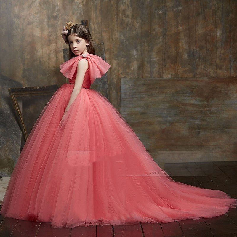 Sea Dragon Dreams watermelon red tulle ball gown for girls with a ruffled shoulder detail for piano recitals