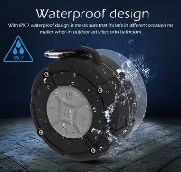 Sea Dragon Dreams IPX7 waterproof Bluetooth speaker with black plastic shell, suction cup, and carrying buckle
