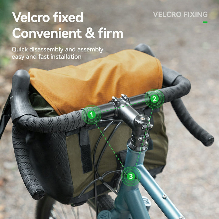 Sea Dragon Dreams waterproof bike handlebar bag with Velcro straps mounted on a gravel bike for secure storage