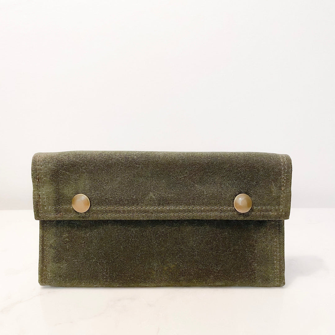 Sea Dragon Dreams olive green waxed canvas fly fishing wallet with brass snap closures, handmade in Maine.