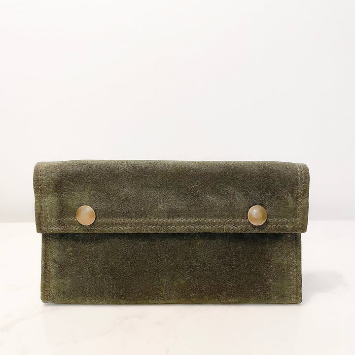 Sea Dragon Dreams olive green waxed canvas fly fishing wallet with brass snap closures, handmade in Maine.