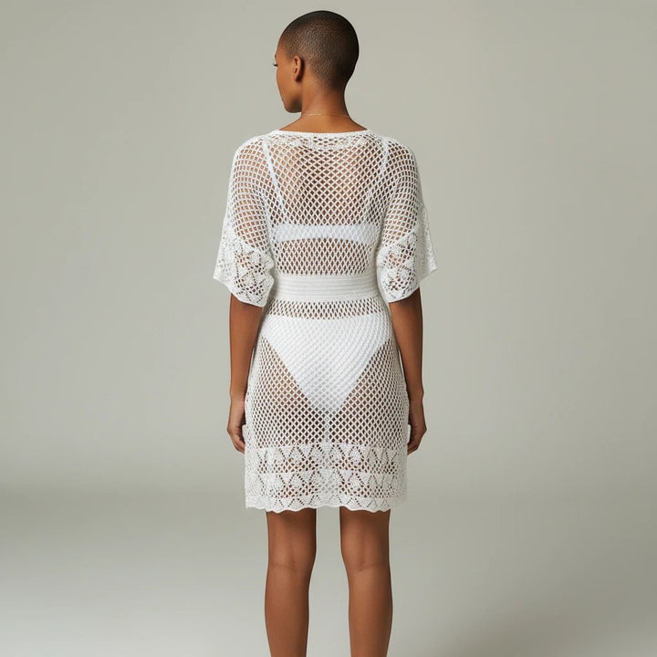 Sea Dragon Dreams white openwork crochet beach cover-up dress with spaghetti straps, back view on a model.