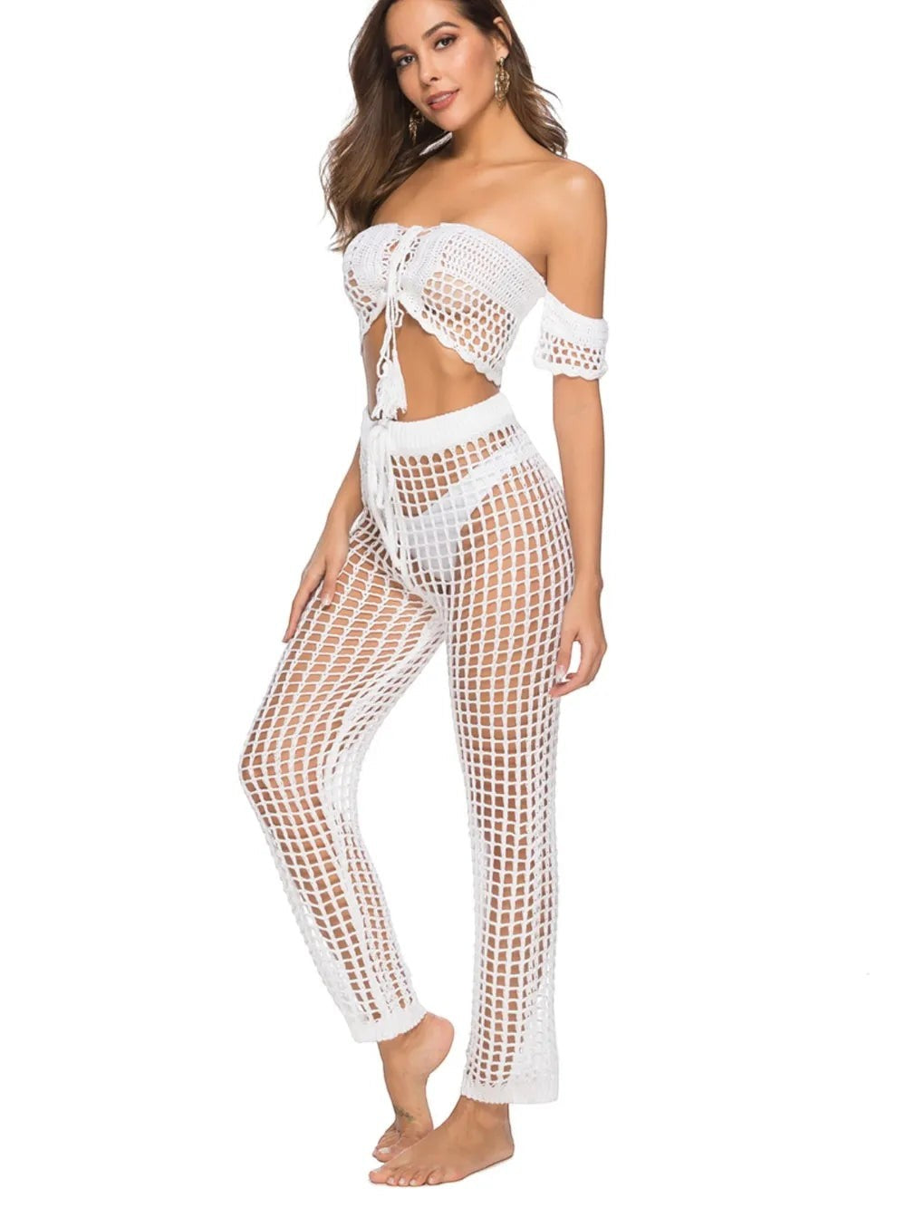 Sea Dragon Dreams white crochet high waist swim pants with cutout mesh design worn by a model