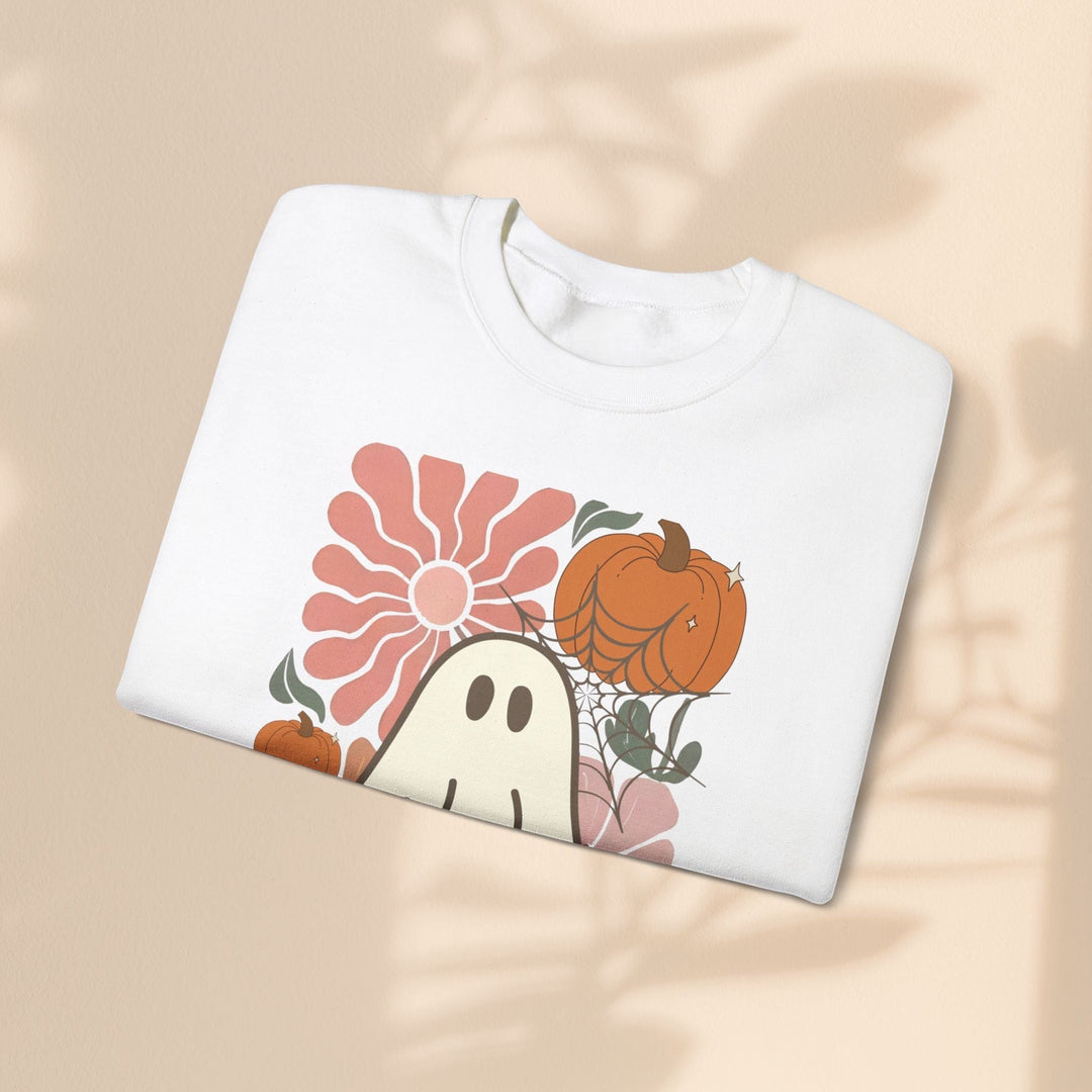 Sea Dragon Dreams white crewneck sweatshirt featuring a retro ghost, pumpkin, and flower graphic print.
