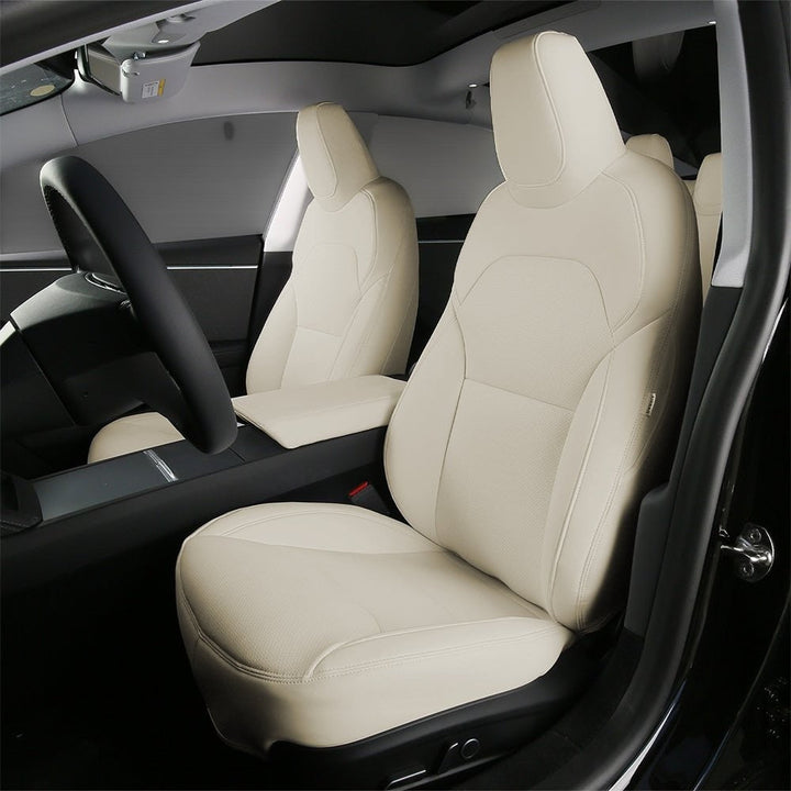 Sea Dragon Dreams white leather seat covers installed in a Tesla Model 3 or Model Y interior for a premium look.
