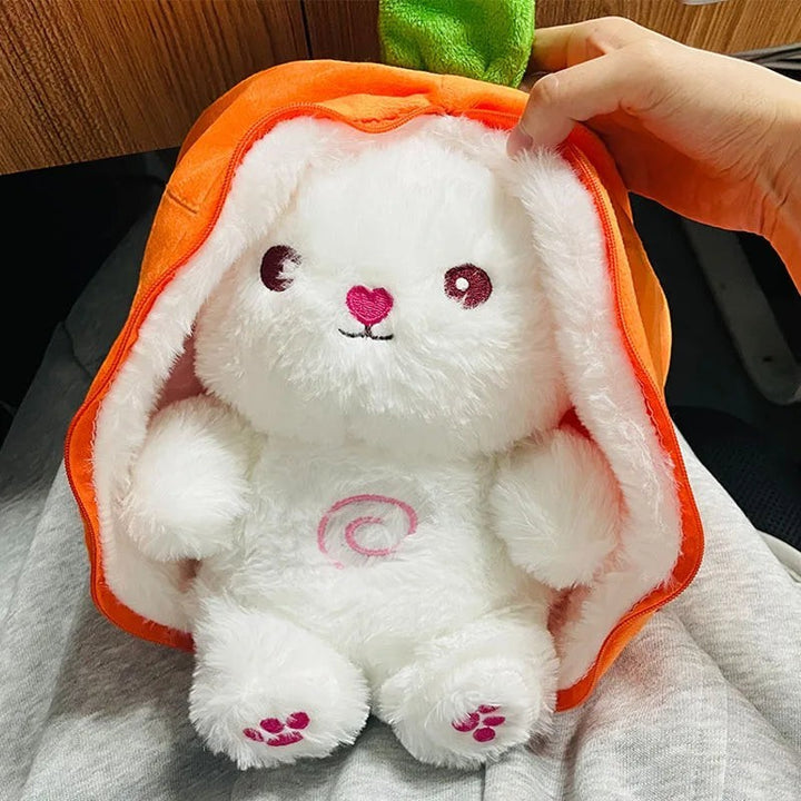 Sea Dragon Dreams white plush bunny doll wearing an orange carrot-shaped hood with embroidered pink details