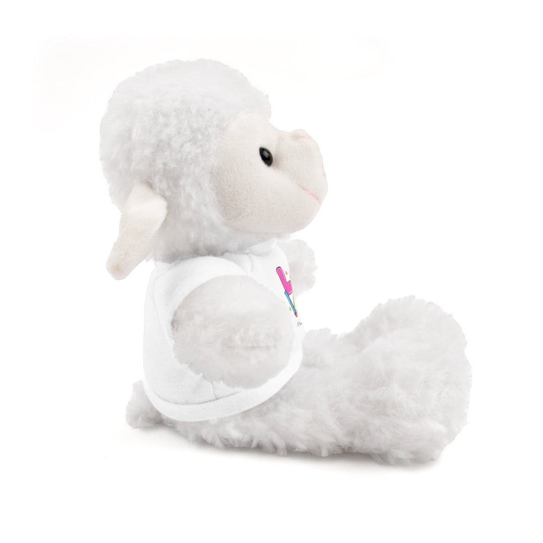 Sea Dragon Dreams white plush sheep stuffed animal wearing a white cotton t-shirt, side view on white background.