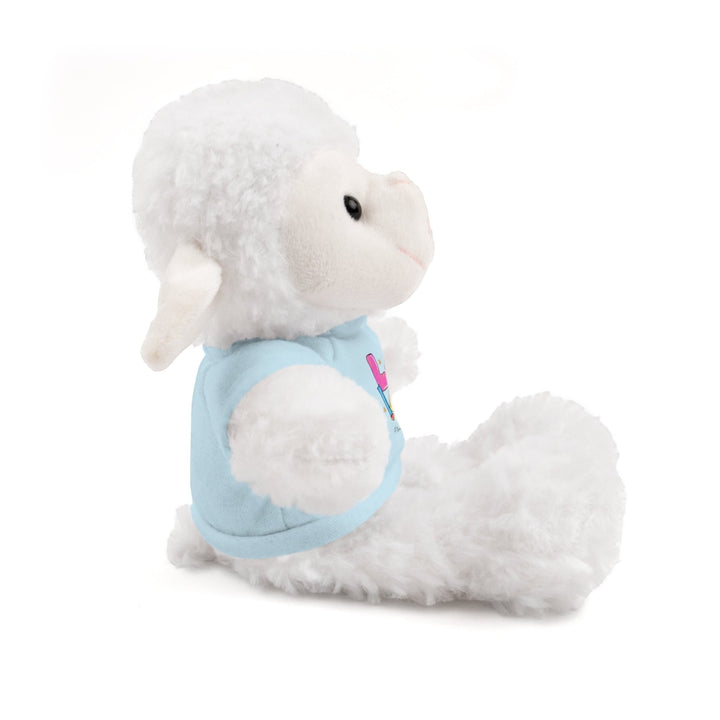 Sea Dragon Dreams white plush sheep stuffed animal wearing a light blue cotton t-shirt, side view.